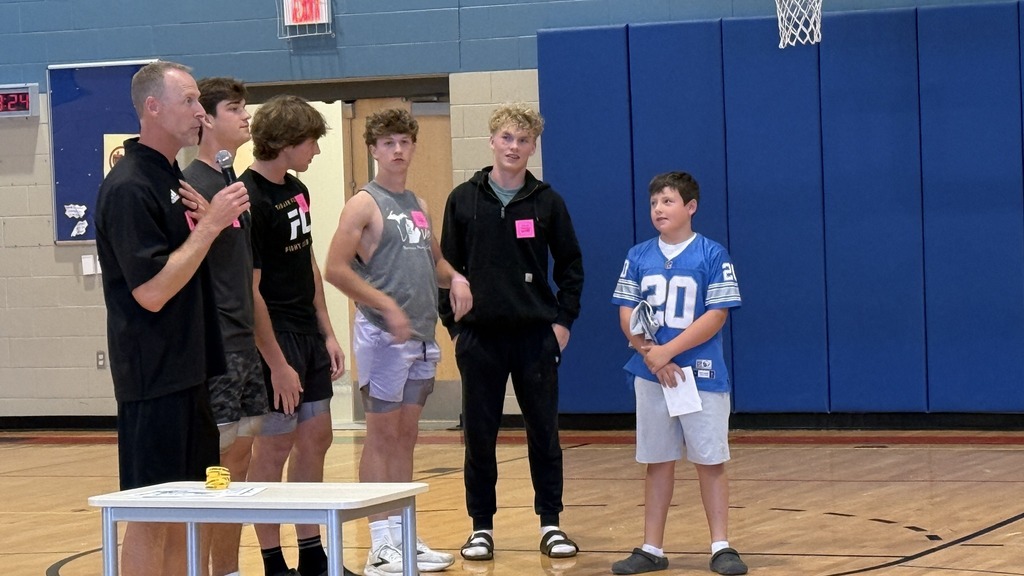 People standing in the school gym