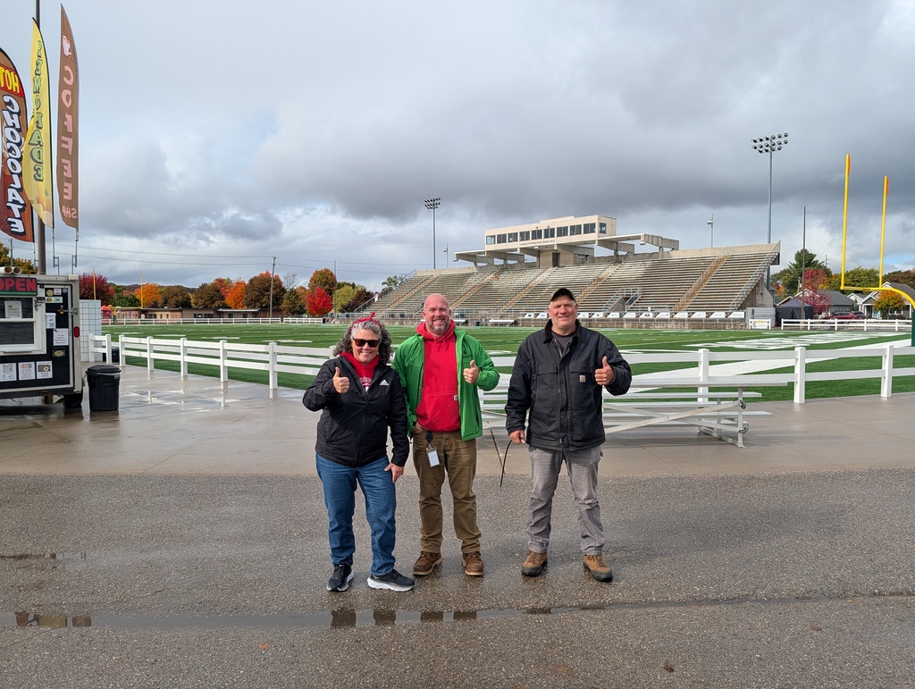 TCAPS staff smiling for picture during Thirlby Field setup
