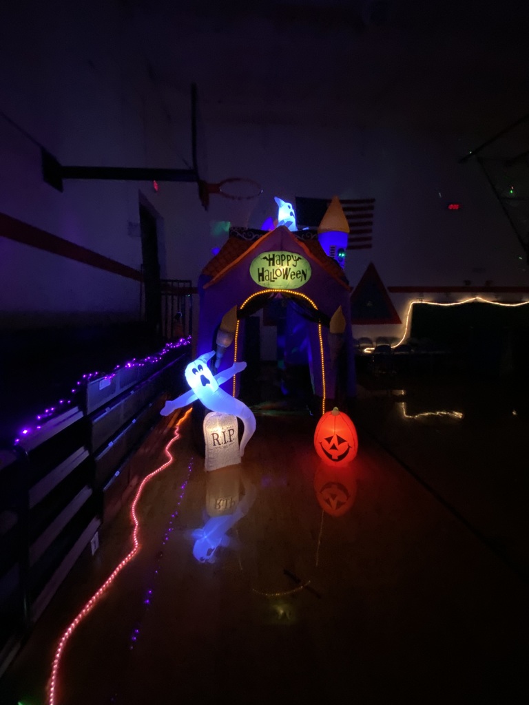 Halloween blow up castle, ghost, tombstone and jack-o-lantern.