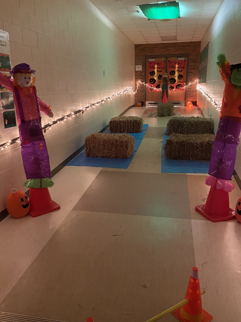 Halloween obstacle coarse with hay bales and scarecrows.