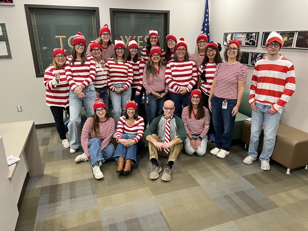 West Senior High staff dressed up as Waldo from Where's Waldo? for a themed event.