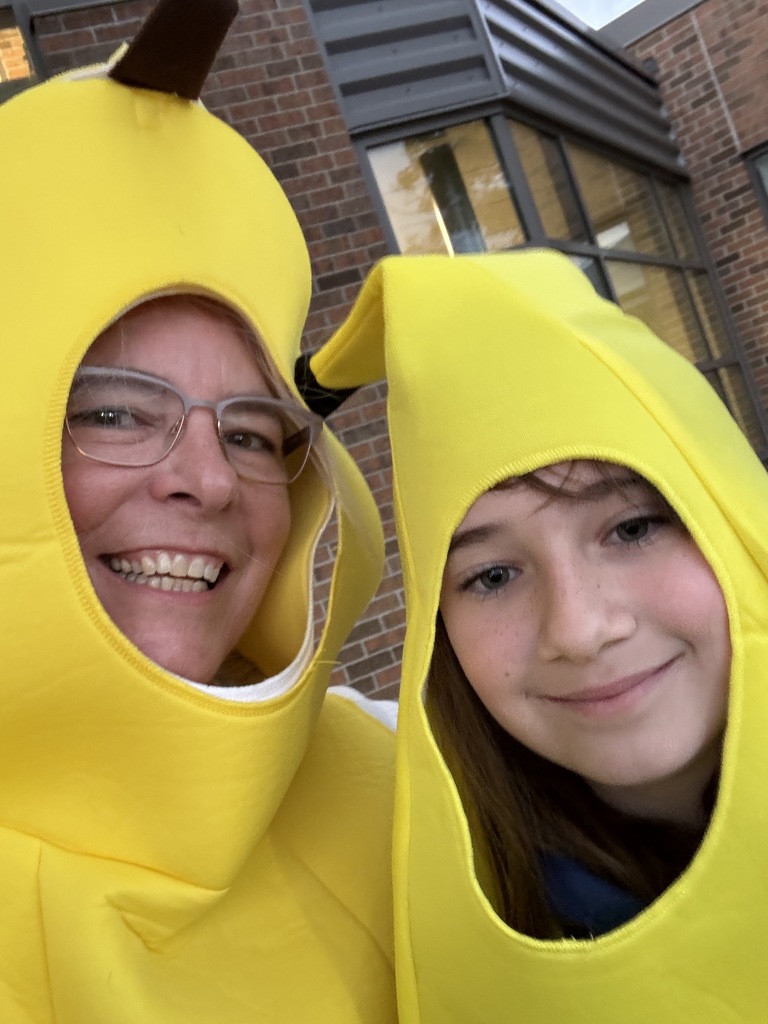 Principal and student dressed as bananas