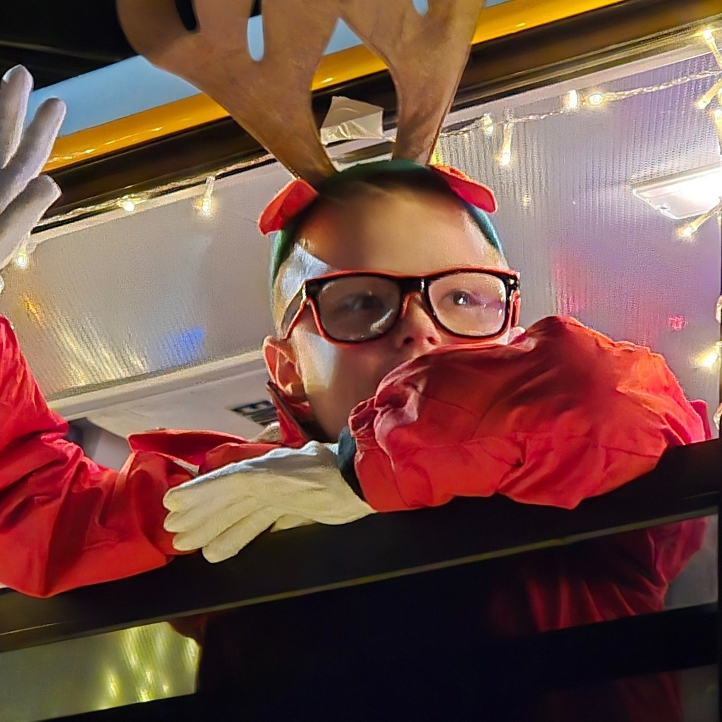 Kid waving out of the bus window