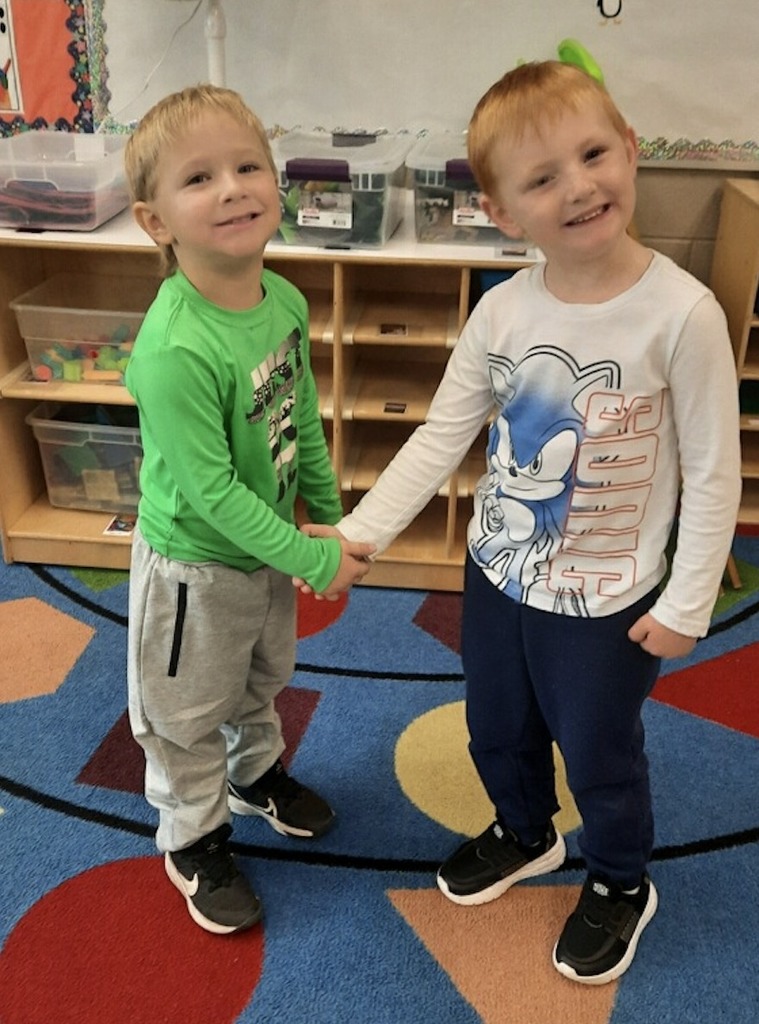 children shaking hands