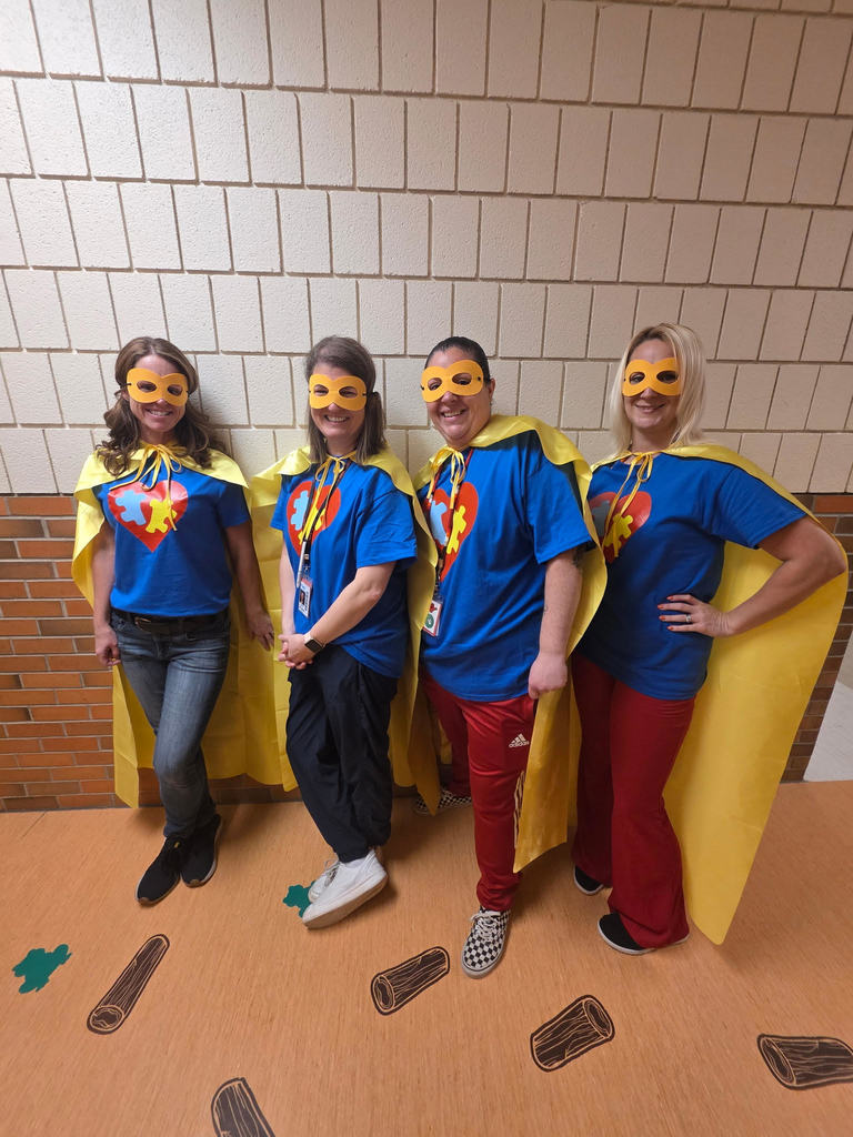 People standing in front of a wall