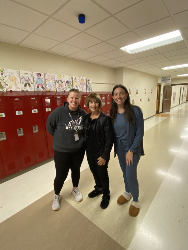 April Kehrer, Cathy Radu and Alexandra Trillet ( three women standing together smiling in front of red lockers)