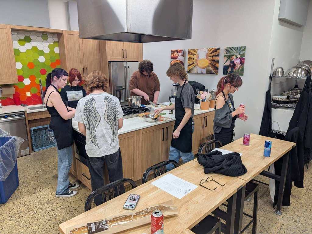 students standing in a kitchen