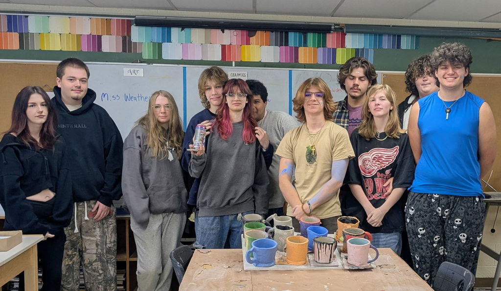 TCHS students in front of their projects with Clay Space