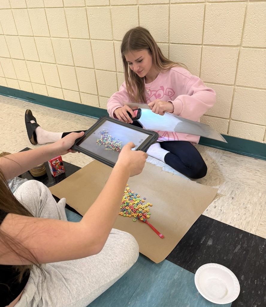 a student taking a photo of cereal