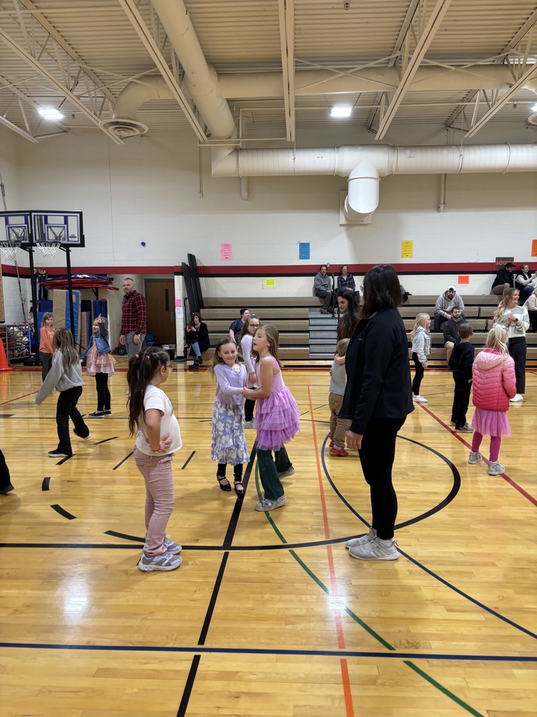 Two girls sashaying through a line dance
