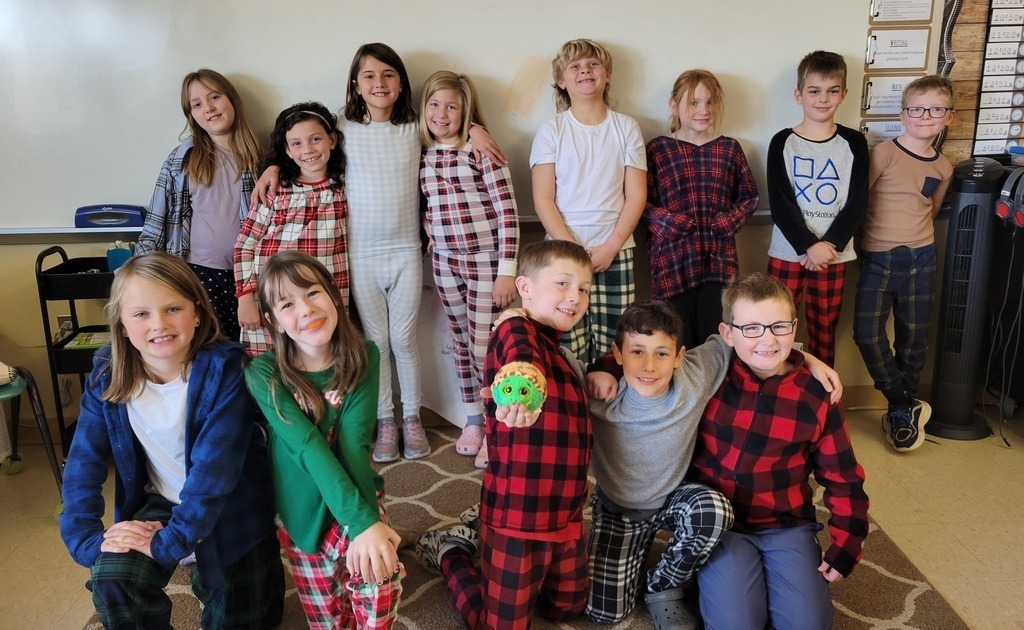 Students standing in a classroom