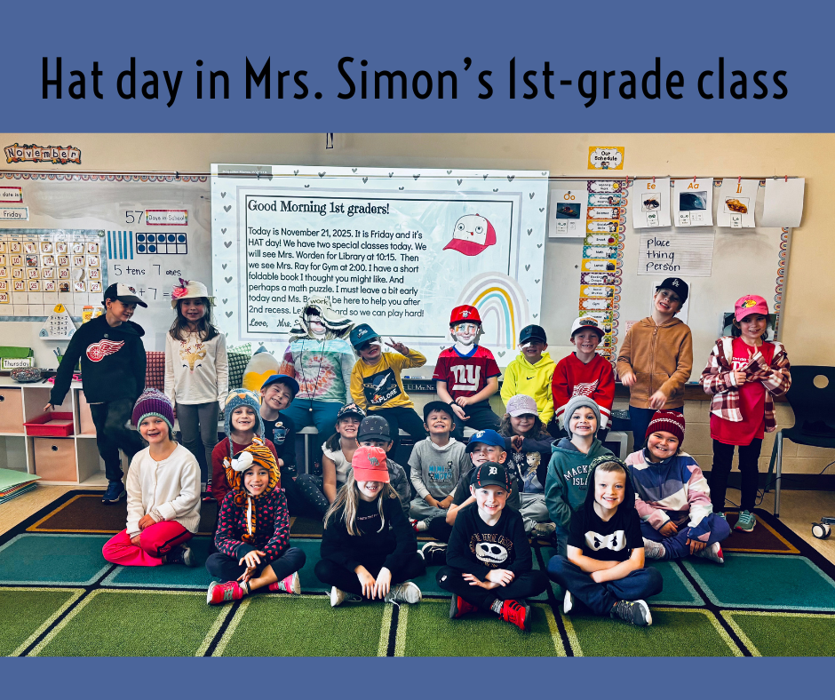 students sitting on the run, in front of the whiteboard all wearing hats and smiling