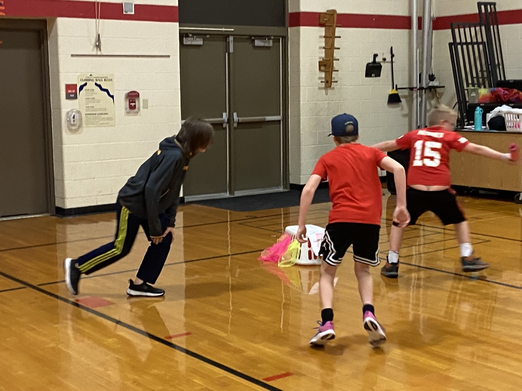 students trying to take the scarfs from the laundry basket