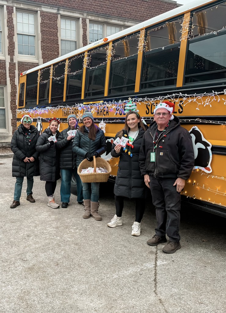 TCAPS Staff in front of the bus decorated for the Light Parade