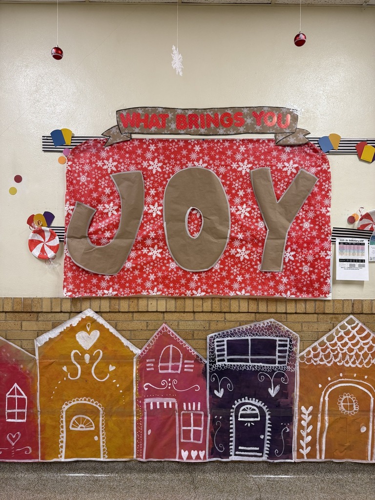 A wall decorated with the word joy