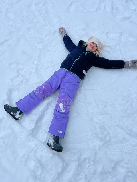 Student making a snow angel