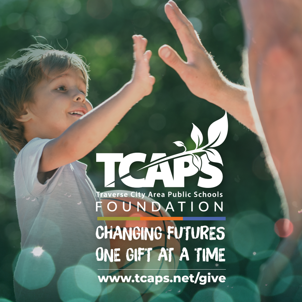 TCAPS Student high fiving with TCAPS Foundation Logo