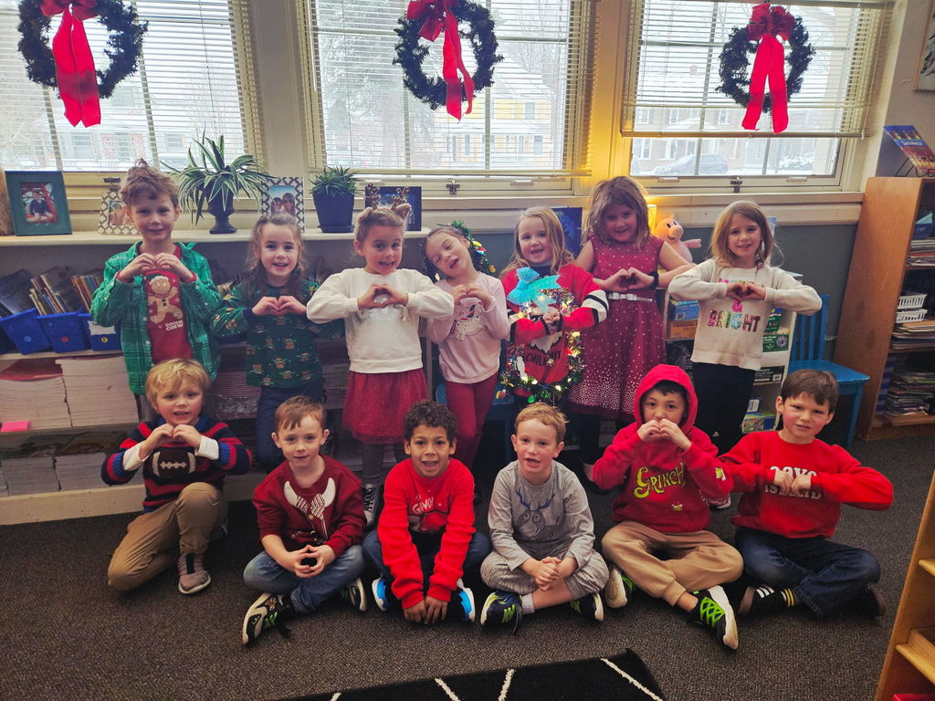 students wearing their Holiday sweaters