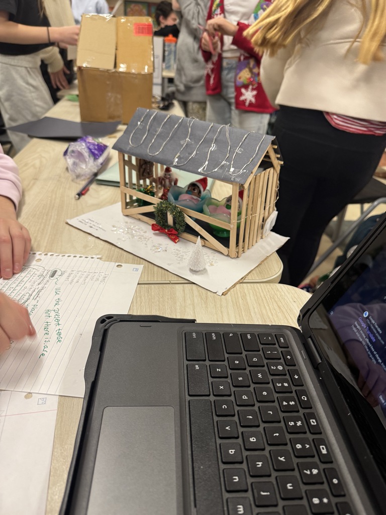 Students in spanish class working on home decorating in Spanish.