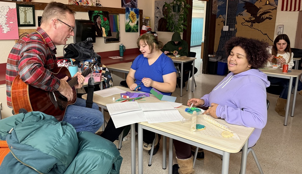 TCHS students and staff singing and decorating cookies