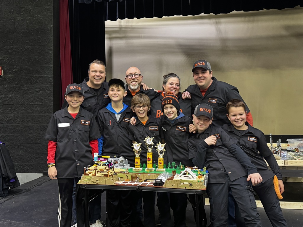 Students showing off their trophy at Lego State Championship