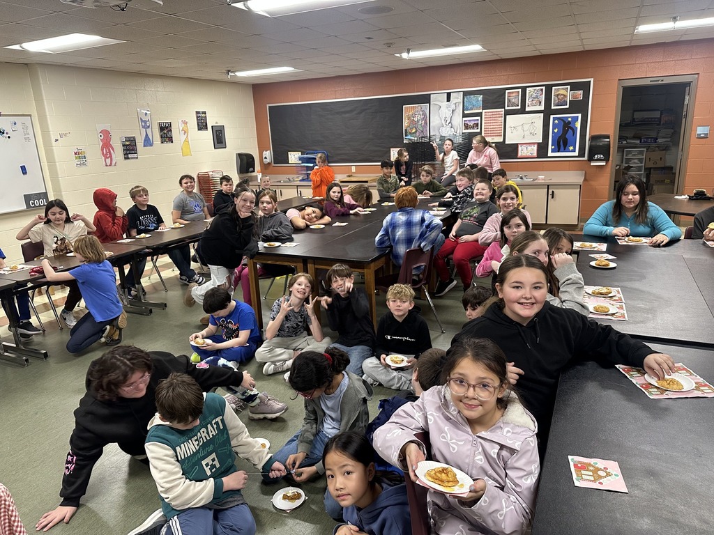 Classroom of students eating the bread that was made