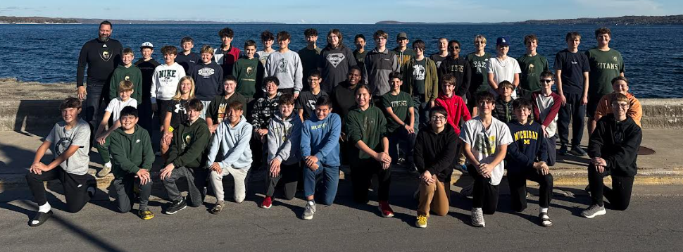 Group photo of tenor/bass choir by the bay in traverse city in the summer