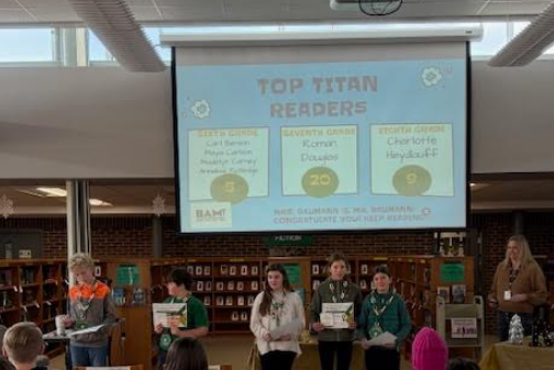 Group photo of Top Titan reading students standing to be recognized