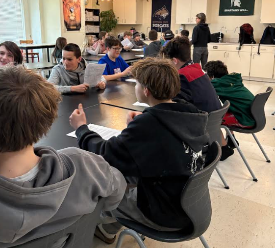 Class view of students engaged in debate