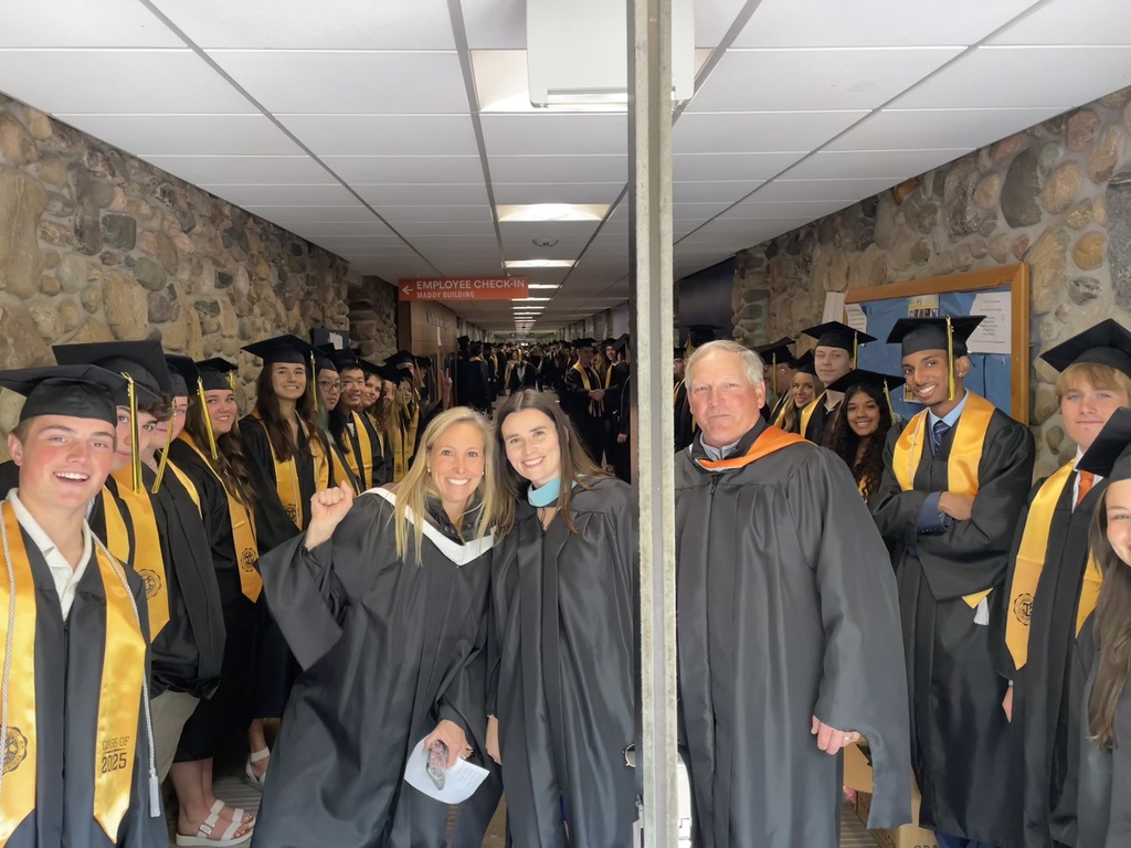 Central High School counselors in graduation robes with CHS graduates