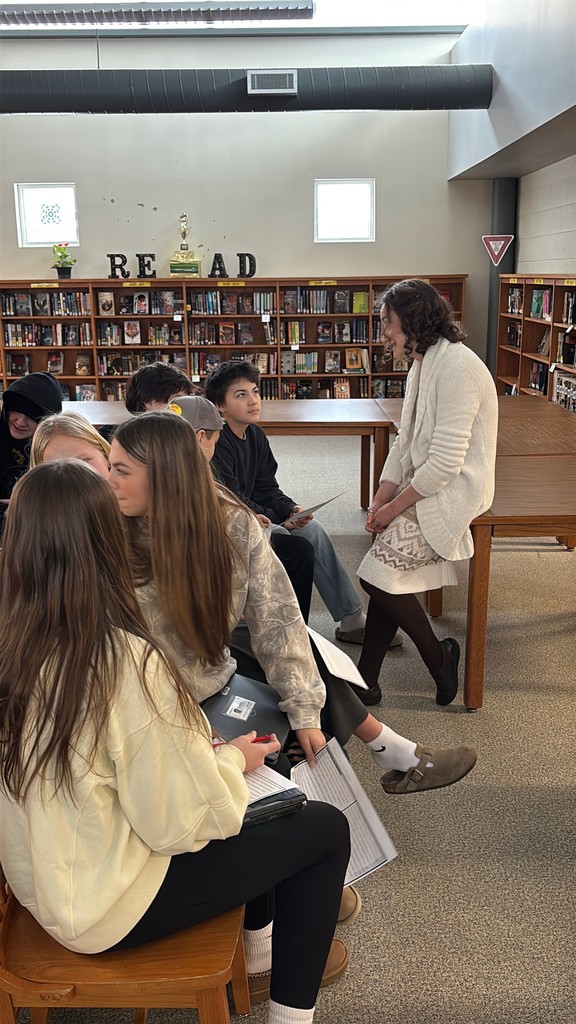 Ms. Donahue talking with a group of students