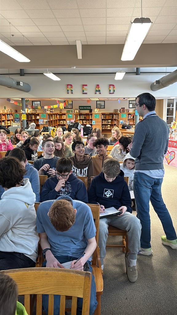 Guest speaker talking with a group of students