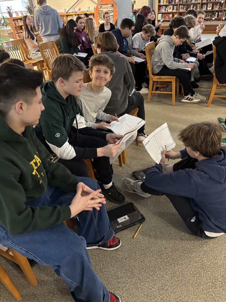 Students writing during LMC writing guest speaker