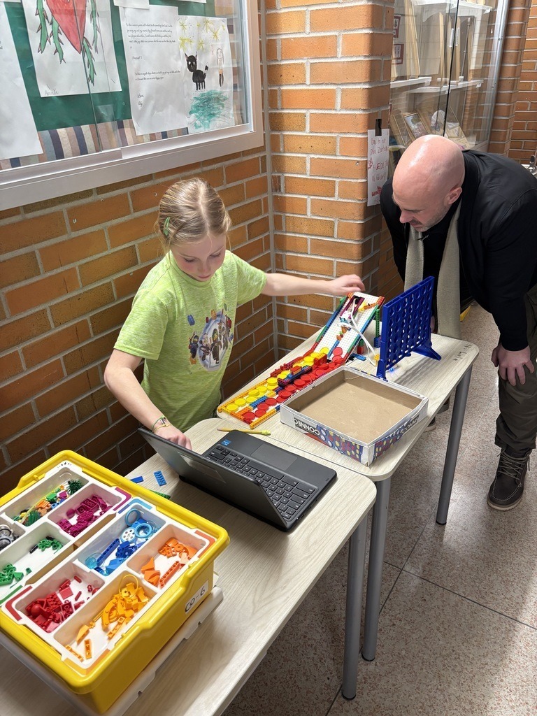 Student showing her someone her project