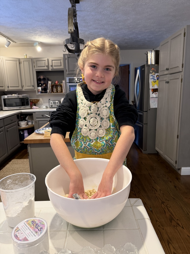 A girl making gnocchi dough in a bowl