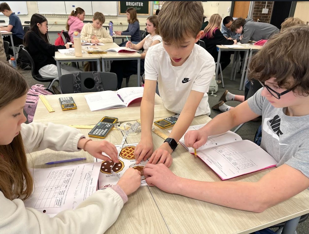 West Middle math students practicing math skills at thier tables