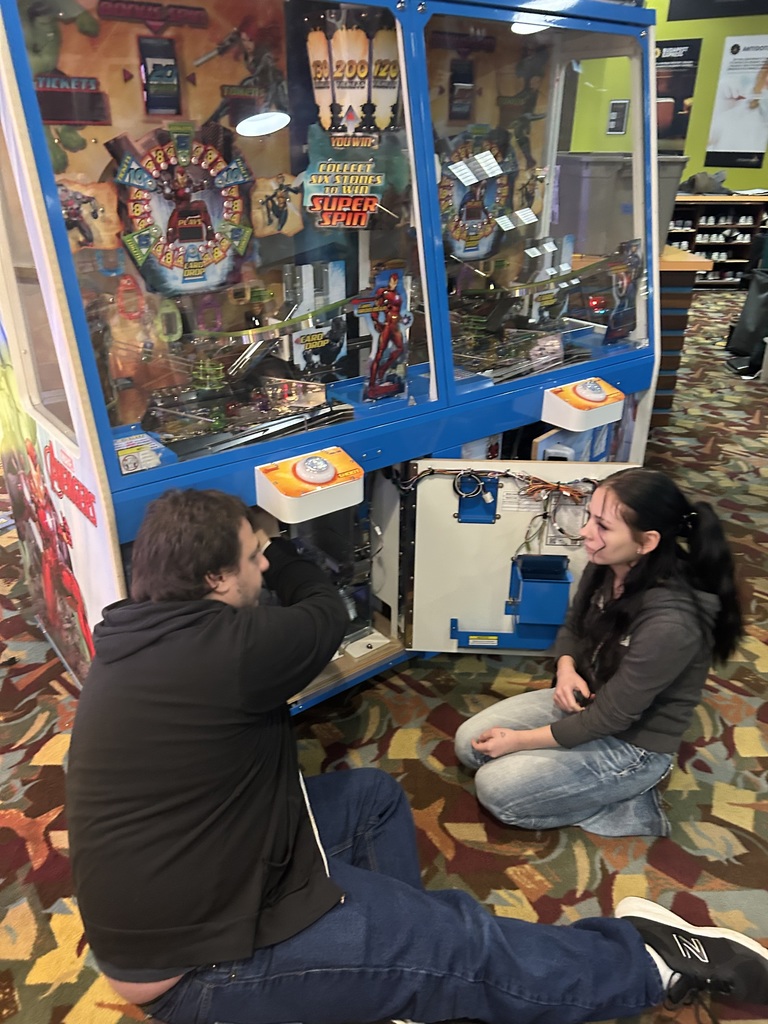 TCHS Student learns about equipment maintenance from an Incredible Mo's employee