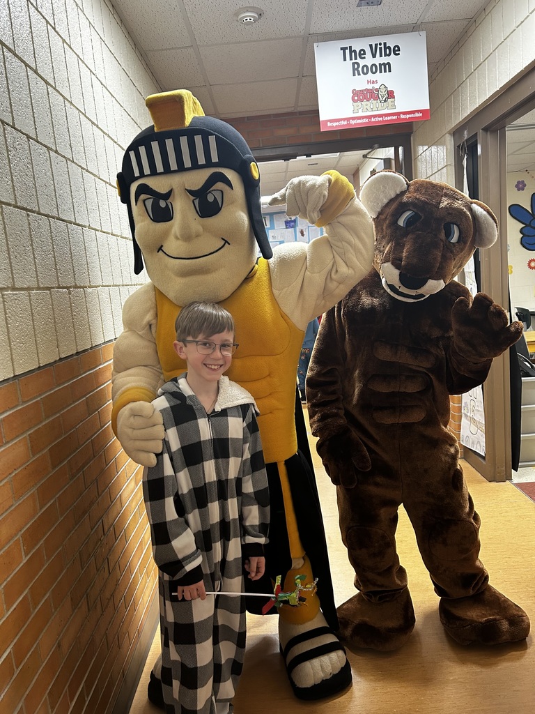 Trojy that mascot and Roary the mascot with a student.  