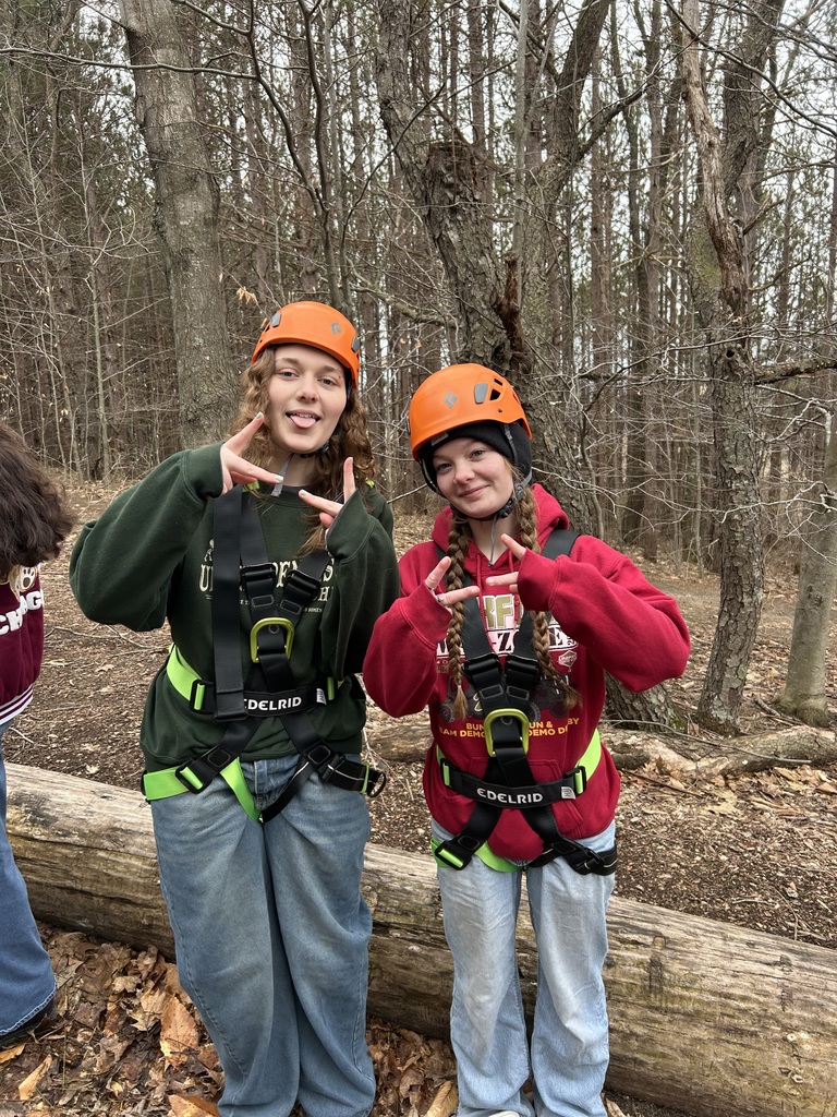 TCHS graduates prepare to zip line at Camp LOC
