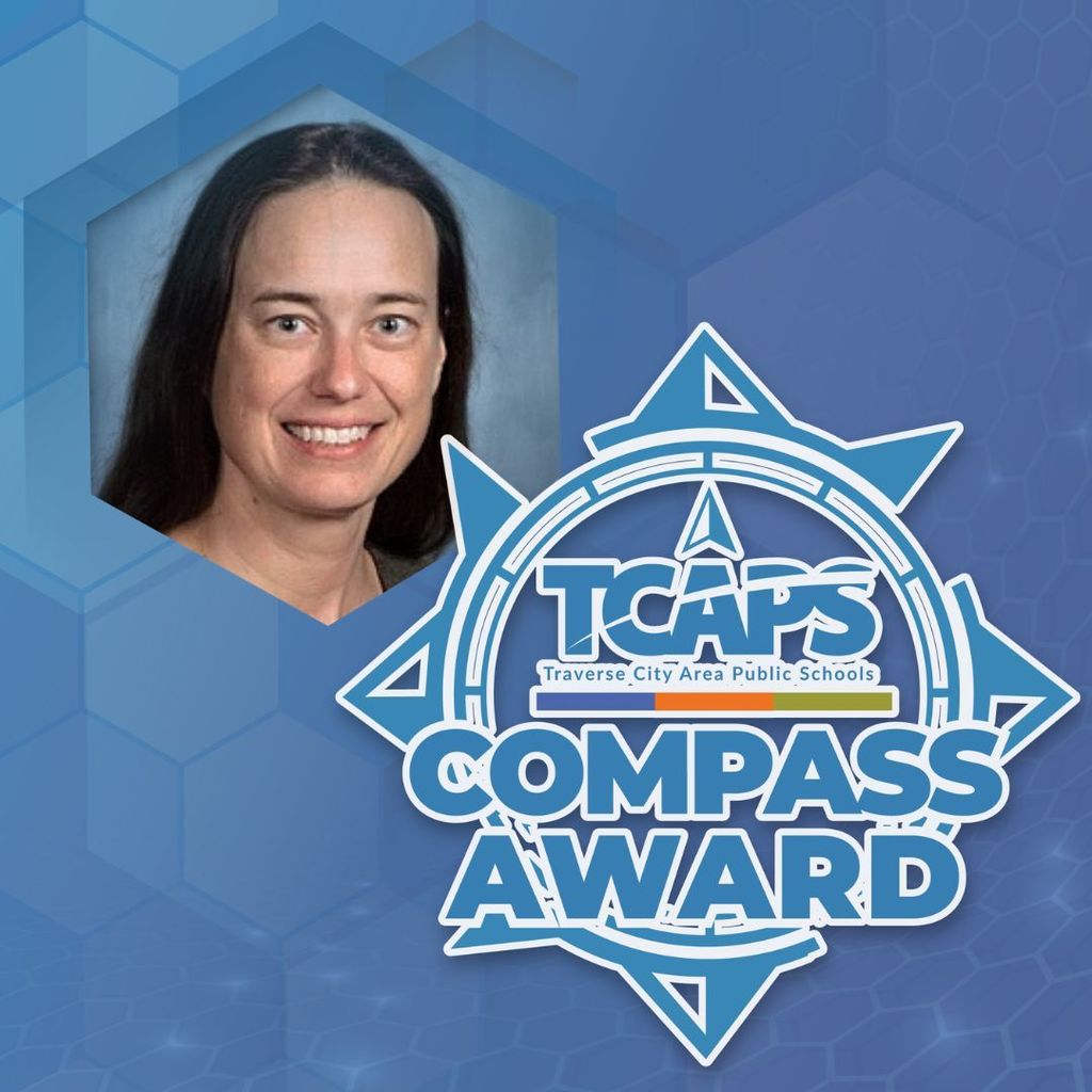 A smiling woman's head on a blue hexagon background, next to a blue logo for TCAPS Compass Award.