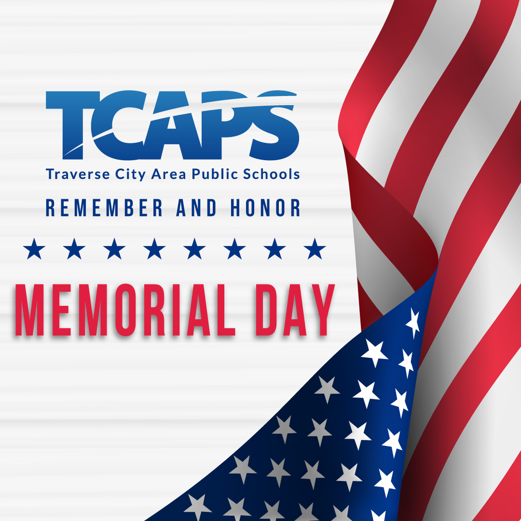 White background with text "TCAPS Traverse City Area Public Schools REMEMBER AND HONOR" and stars. The American flag is diagonally across.