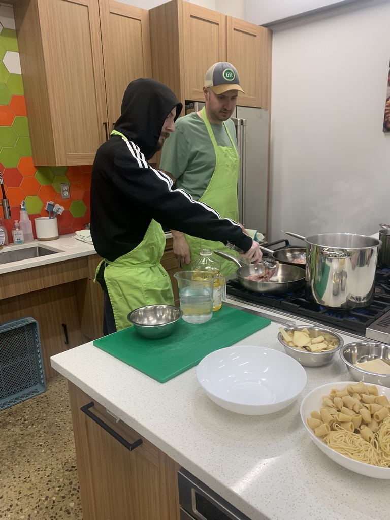 TCHS student prepares a meal with Chef Adam at Oryana
