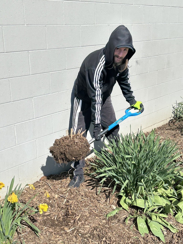 TCHS student plants flowers