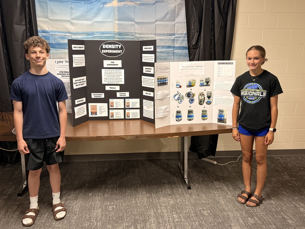 7th grade honors science students with their completed honors projects.