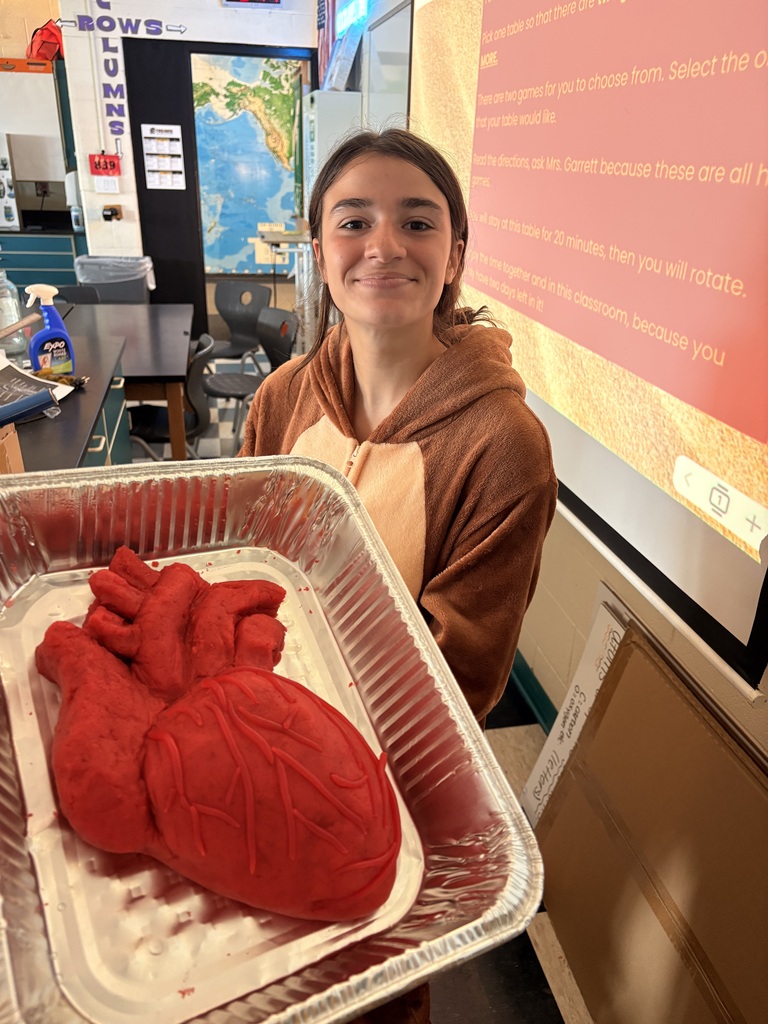 7th grade honors science students with their completed honors projects.