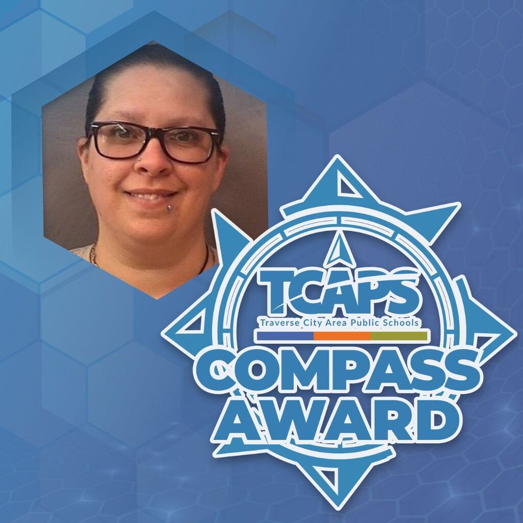 A smiling woman with glasses over a hexagonal pattern and "TCAPS Compass Award" logo.
