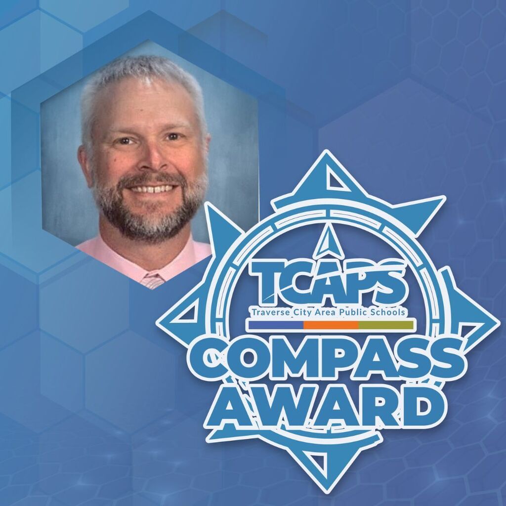 A man with white hair and a beard smiles. His photo is on the left, and the logo for TCAPS Compass Award is on the right.