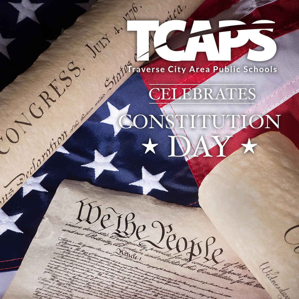 US flag, Constitution text, and scrolls with "We the People" in front of "TCAPS Celebrates Constitution Day"