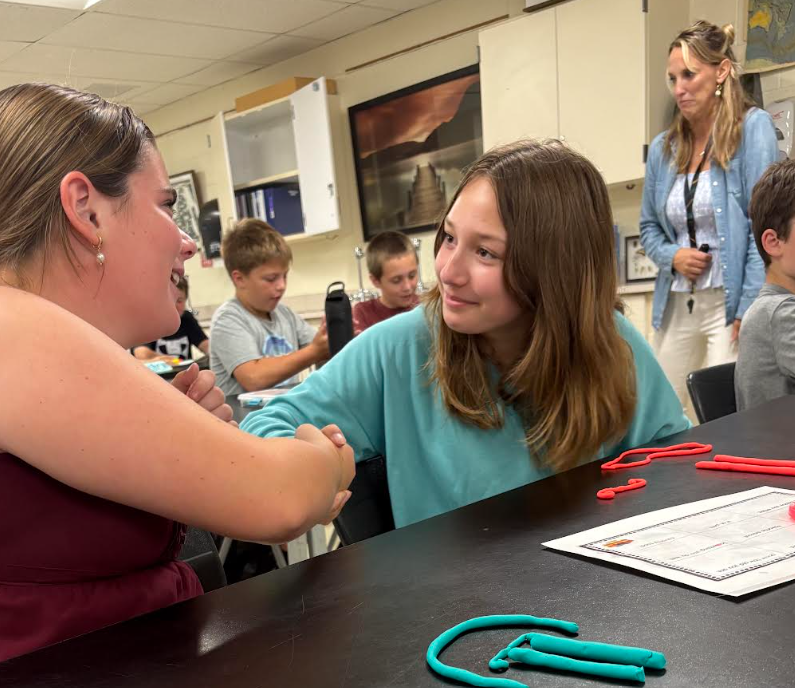 Students shaking hands