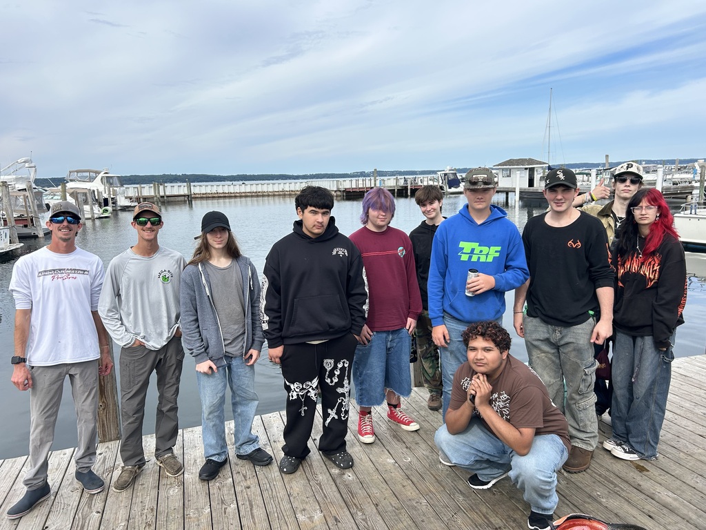 TCHS students pose on the dock with Charter Fishing Staff